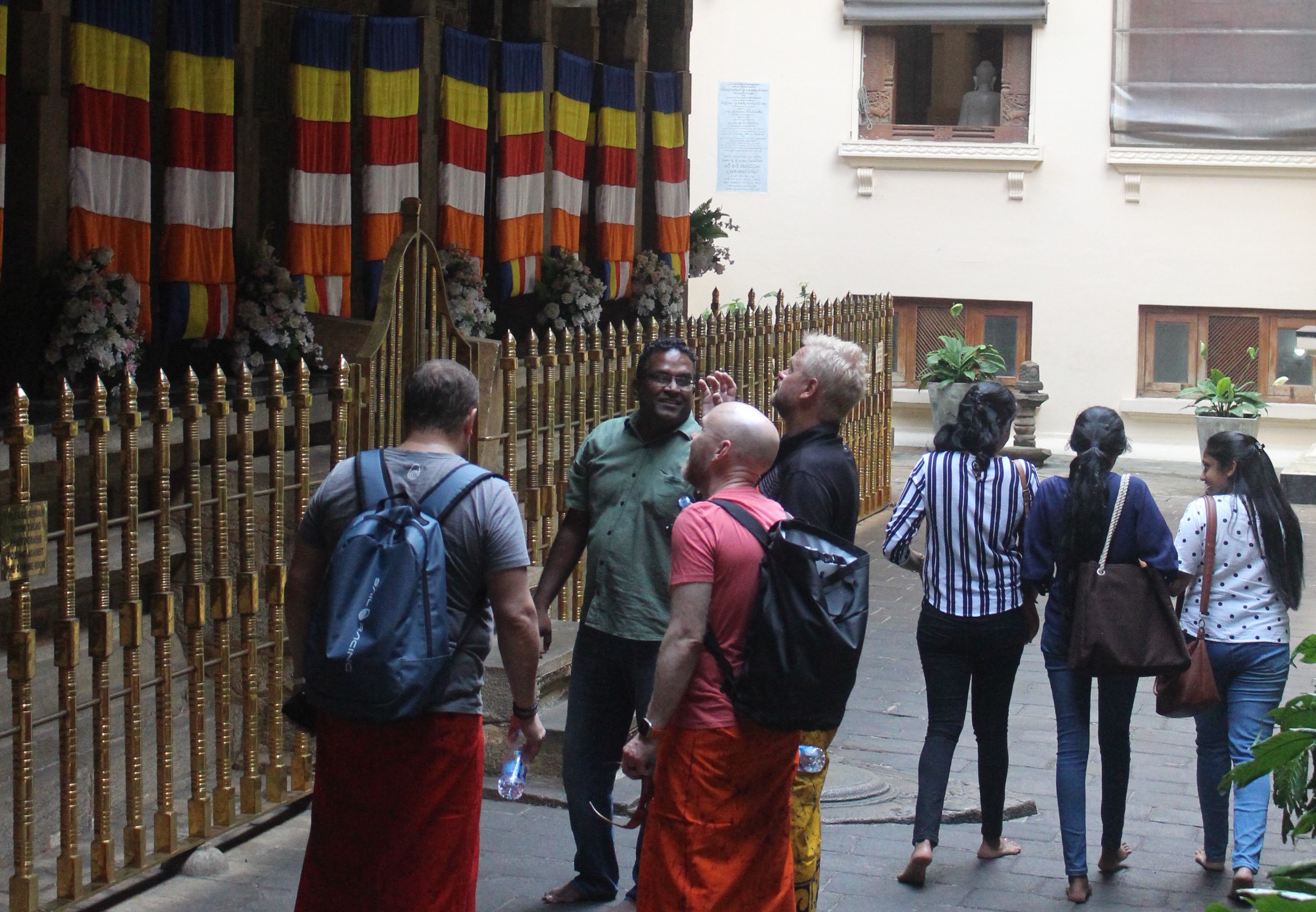 Tourists being informed bout the Kandyan culture