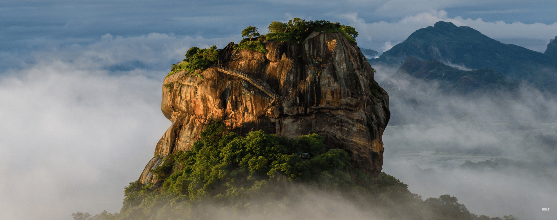 Sigiriya Rock Fortress rising above the Sri Lankan jungle at sunrise